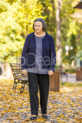 Depressed senior woman outdoors