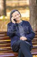 Senior woman talking on smartphone outdoors
