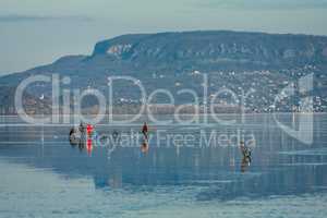 Ice fishing on the lake Balaton in Hungary