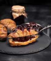croissant with strawberry filling and jam