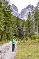 Woman hiking in the nature park Geisler-Puez in South Tyrol
