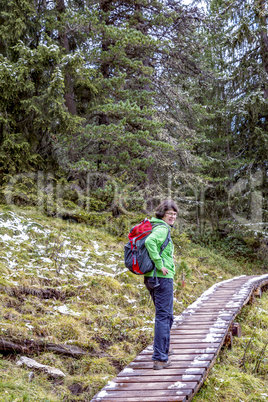 Woman hiking in the nature park Geisler-Puez in South Tyrol