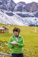 Woman hiking in the nature park Geisler-Puez in South Tyrol