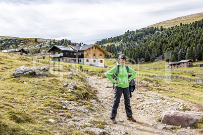 Traveller before Brogles alp in South Tirol