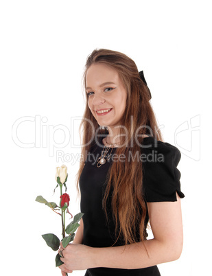 Lovely woman in bla+D1:J49ck dress holding roses