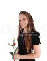 Lovely woman in bla+D1:J49ck dress holding roses