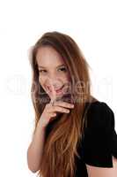 Woman holding finger over her mouth