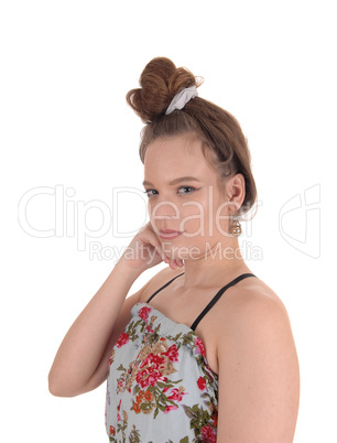 Young woman in dress and bun hair