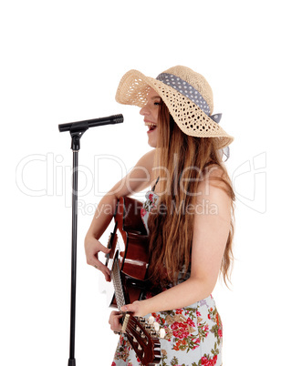 Woman playing guitar and singing