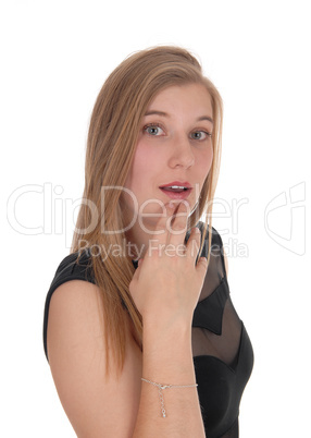 Woman looking puzzled with hand on chin