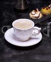 White ceramic cup with black coffee
