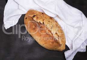 baked loaf of bread with raisins