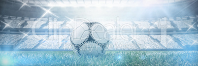 Composite image of soccer ball on white marking line