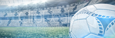 Composite image of soccer ball on white marking line