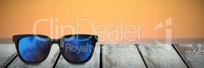 Composite image of close-up of sunglasses