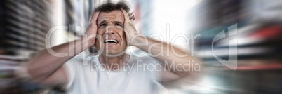 Composite image of mature man with head in hands suffering from headache