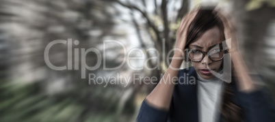 Composite image of portrait of businesswoman suffering from headache