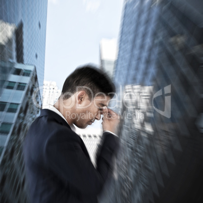 Composite image of side view of businessman suffering from headache