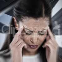 Composite image of businesswoman having an headache