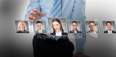 Composite image of midsection of businessman pretending to touch invisible object