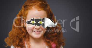Girl with torn paper on eyes and drawn eyes