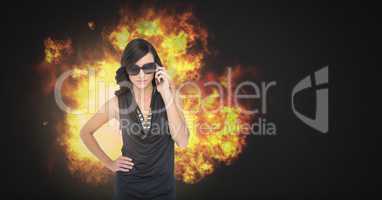 Cool sexy woman in sunglasses with burning fire flames