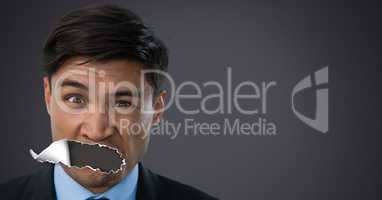 Man with torn paper on mouth
