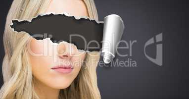 Woman with torn paper on eyes