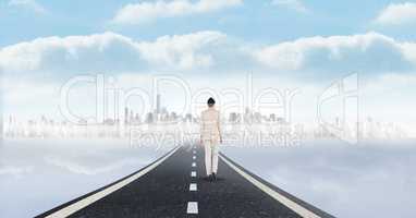 Businesswoman walking on road