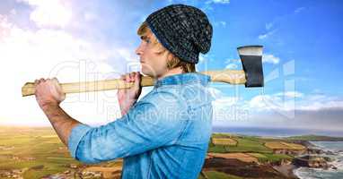 Man holding axe with dramatic landscape