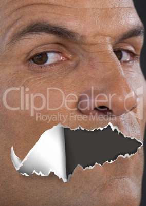 Man with torn paper on mouth