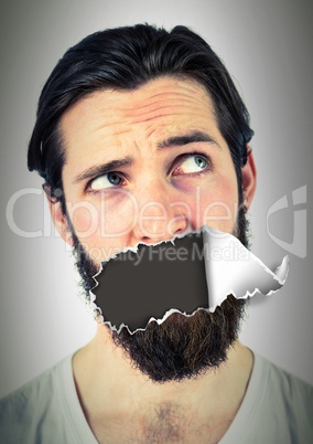 Man with torn paper on mouth