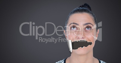 Woman with torn paper on mouth