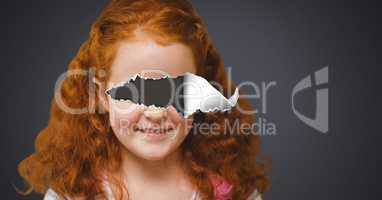 Girl with torn paper on eyes