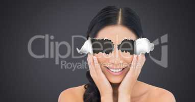 Woman with torn paper on eyes