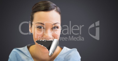 Woman with torn paper on mouth