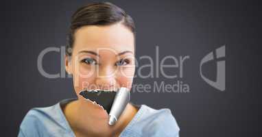 Woman with torn paper on mouth