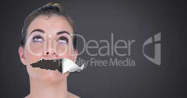 Woman with torn paper on mouth