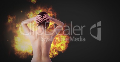 Nude dramatic woman with burning fire flames