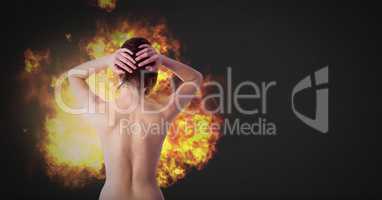 Nude dramatic woman with burning fire flames