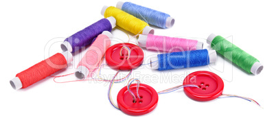 Sewing thread and buttons isolated on white background. Wide pho