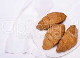 three freshly baked croissants