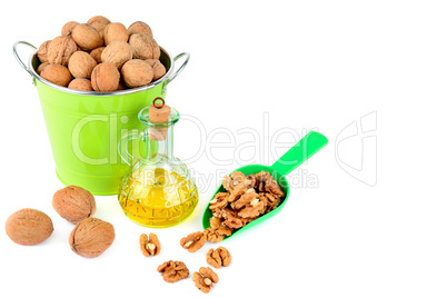 Oil of walnut and nut fruit isolated on white background.