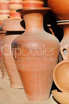 Handmade ceramic clay brown terracotta amphora souvenirs at stre