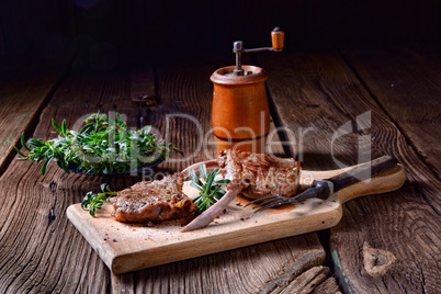 Grilled lamb chops an old board