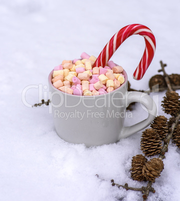 gray ceramic cup with hot chocolate and marshmallows