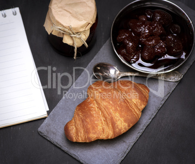 baked croissant and strawberry jam