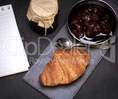 baked croissant and strawberry jam