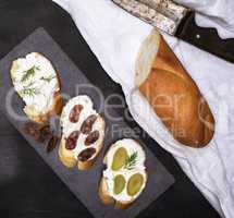 sandwiches with cream cheese on a black background