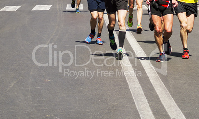 Detail of a group of runners during a city marathon